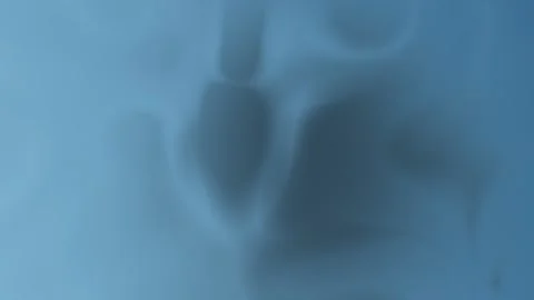 Smooth blue abstract with fluid shapes and soft edges, seamless loop background. Stock Footage 310143534