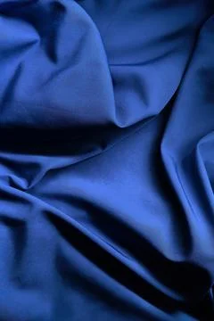 Smooth Blue Fabric Texture With Elegant Drapes Stock Photos