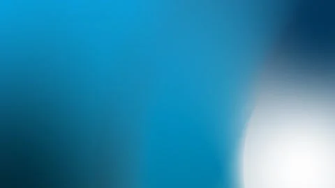 Smooth blue gradient with soft white glow on right. Seamless loop background. Stock Footage 309855725