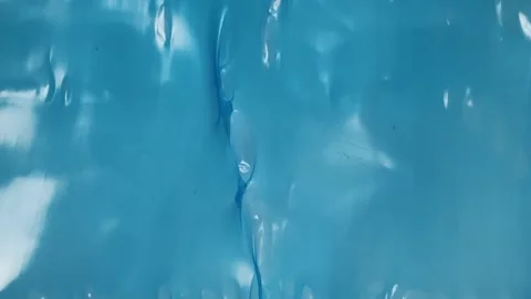 Smooth blue plastic surface with subtle ripples Video stock 340581353