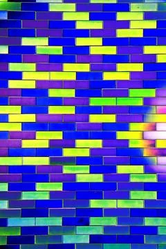 Smooth brick, smooth colored brickwork. Changed color scheme. Colorful backgr Stock Photos