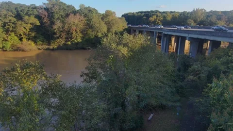 The smooth brown waters of the Chattahoochee river in Atlanta Georgia Stock Footage 210884279