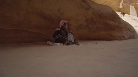 Smooth camera movement of bedouin  playing Rabab Video stock 102519608