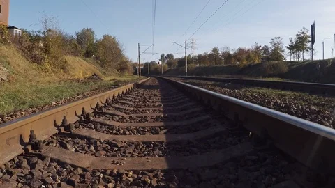 Smooth camera movement forward on the railway in autumn Stock Footage 97990573