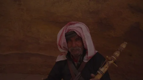 Smooth camera movement of a man playing Rabab Stock Footage 102519583