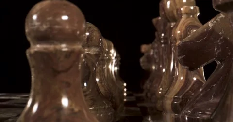Smooth camera movement over chess pieces in an engaging display Stock Footage 340482725