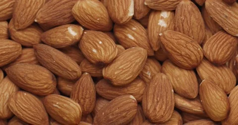 Smooth Camera Movement Over a Handful of Almonds. Video stock 142319767