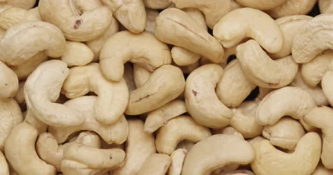 Smooth Camera Movement Over a Handful of Cashew Nuts. Vídeo Stock 142320002