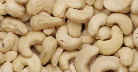 Smooth Camera Movement Over a Handful of Cashew Nuts. Vídeo Stock 142320062