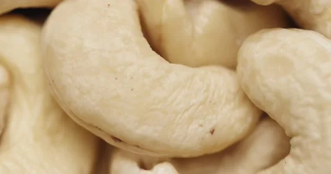 Smooth Camera Movement Over a Handful of Cashew Nuts. Video stock 142320088