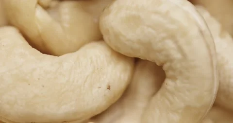 Smooth Camera Movement Over a Handful of Cashew Nuts. Vídeo Stock 142320107
