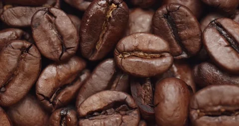 Smooth Camera Movement Over a Handful of Coffee Beans. Stock Footage 142320196