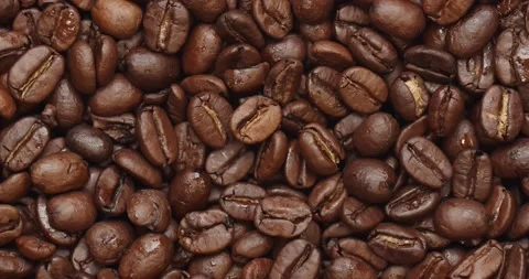 Smooth Camera Movement Over a Handful of Coffee Beans. 스톡 동영상 142320306