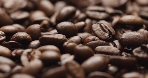 Smooth Camera Movement Over a Handful of Coffee Beans. Stockbeeldmateriaal 142320428