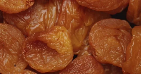 Smooth Camera Movement Over a Handful of Dried Apricots. Видео 142400710
