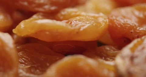 Smooth Camera Movement Over a Handful of Dried Apricots. Видео 142400726