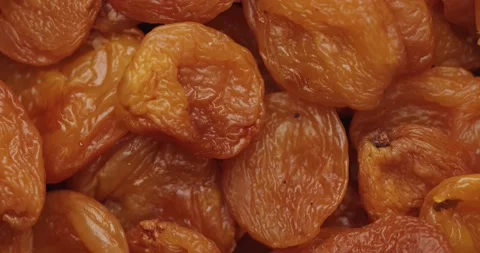 Smooth Camera Movement Over a Handful of Dried Apricots. Stock Footage 142400771