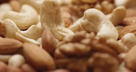 Smooth Camera Movement Over a Handful Mix of Nuts. Stock Footage 142514276