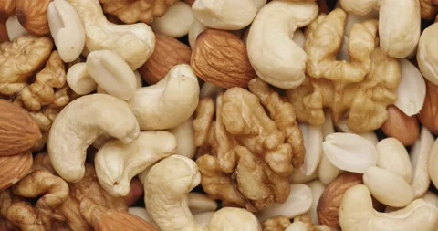 Smooth Camera Movement Over a Handful Mix of Nuts. Vídeos de archivo 142514333