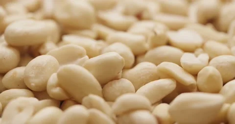 Smooth Camera Movement Over a Handful Peeled Peanuts. Stock Footage 142657560
