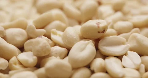 Smooth Camera Movement Over a Handful Peeled Peanuts. Stock Footage 142657568