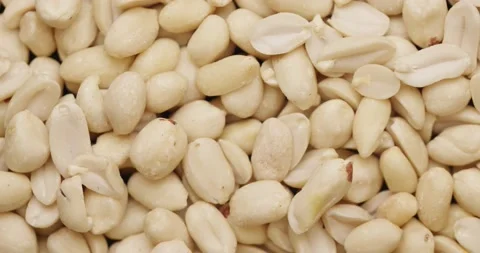 Smooth Camera Movement Over a Handful Peeled Peanuts. Stock Footage 142657579