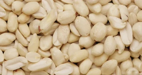 Smooth Camera Movement Over a Handful Peeled Peanuts. Stock Footage 142657625