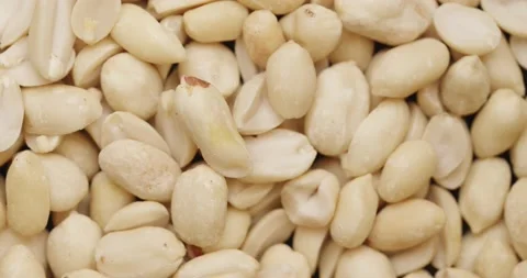 Smooth Camera Movement Over a Handful Peeled Peanuts. Stock Footage 142657637