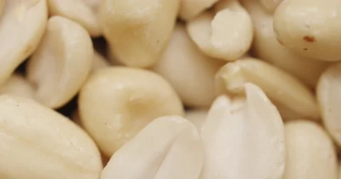 Smooth Camera Movement Over a Handful Peeled Peanuts. Stock Footage 142657655