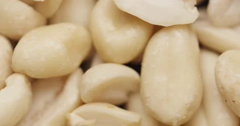Smooth Camera Movement Over a Handful Peeled Peanuts. Stock Footage 142657657
