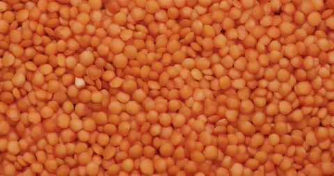 Smooth Camera Movement Over a Handful Red Lentils. Stock Footage 142695599