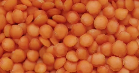 Smooth Camera Movement Over a Handful Red Lentils. Stock Footage 142695601