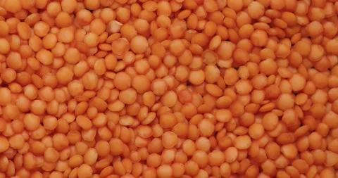 Smooth Camera Movement Over a Handful Red Lentils. Stock Footage 142695891