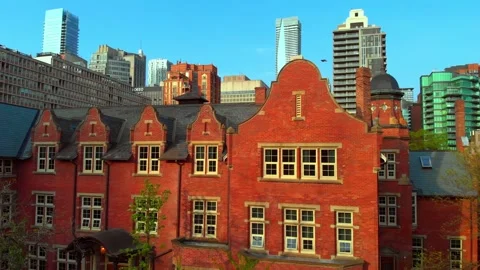 Smooth camera movement reveals details of a red brick building's facade Stock Footage 307553183