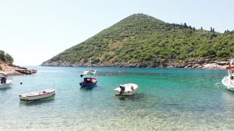 Smooth camera movement showing moored boats at a small harbor in Ithaca Stock Footage 164613867