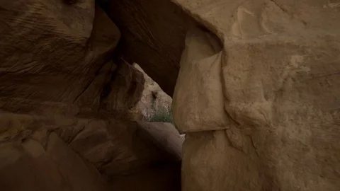 Smooth camera movement through a little cave hole Stock Footage 103522649