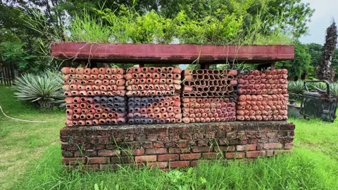 Smooth camera orbit around a large outdoor terracotta installation made from Stock Footage 344582660