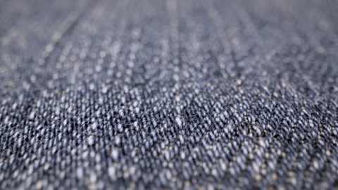 Smooth camera panning across detailed blue jean cloth material Stock Footage 340902516