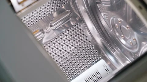 Smooth camera parallax above the top loading washing drum. Clean shiny drum with Vídeo Stock 229946755