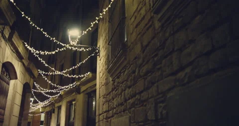 Smooth camera shot along narrow street at the night in the center of Barcelona Stock-Footage 140970318