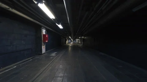 Smooth camera steady shot around old long industrial tunnel Vidéo 63449025