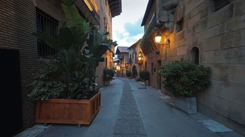 Smooth camera steady slide shot around old Spain village narrow street Stock Footage 80354649