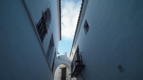 Smooth camera steady slide shot around old south Spain village narrow street Stock Footage 80610746