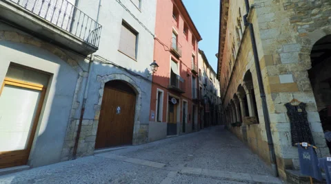 Smooth camera steady wide agle shot along narrow street in the old europe Stock Footage 65880284