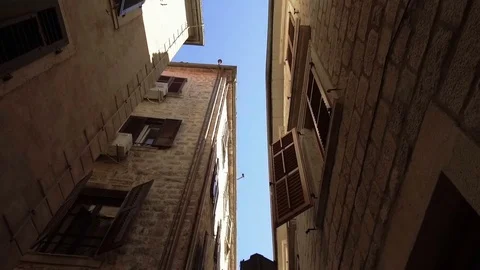 Smooth camera steady wide angle shot along street in the old town Kotor Stock Footage 85106469