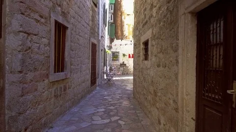 Smooth camera steady wide angle shot along street in the old town Kotor Stock Footage 85107895