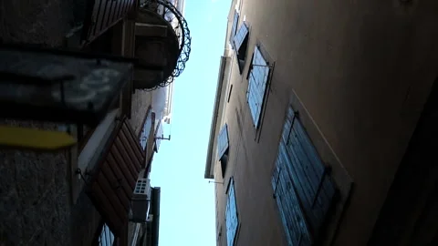 Smooth camera steady wide angle shot along street in the old town Kotor Stock Footage 102176640