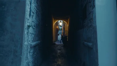 Smooth camera track of walking down a cobbled old street in southern european Stock Footage 88903416