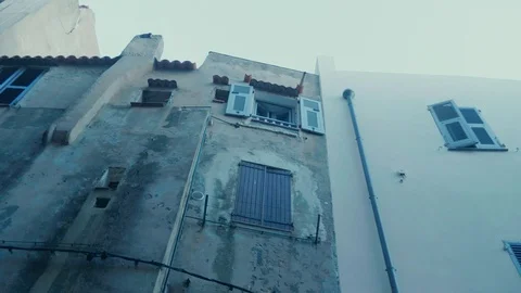 Smooth camera track of walking down a cobbled old street in southern european Stock Footage 88903421