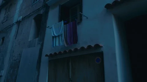 Smooth camera track of walking down a cobbled old street in southern european Stock Footage 88903425